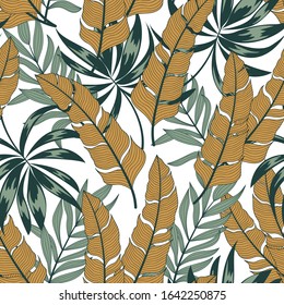 Abstract tropical seamless pattern with colorful plants and leaves on a white background. Jungle leaf seamless vector floral pattern background. Trendy summer Hawaii print.