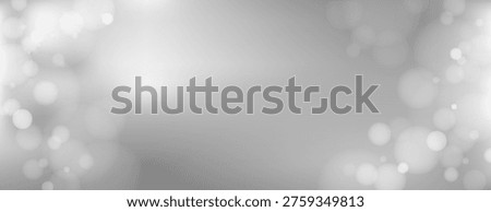 Abstract vector background with soft gray bokeh lights and blurred circles, creating a dreamy and elegant atmosphere. Ideal for modern design projects.