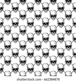 Abstract vector illustration black and white seamless background with skulls and bones. Design for print on fabric or t-shirt.