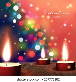 Abstract vector Illustration.  Candles on a wooden surface. In the background is blurred silhouette of a Christmas tree with lights. Snowflakes and sparkles. The festive mood.