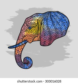 Abstract vector image of a head of an elephant watercolor. colorful image of an elephant in a profile with black stroke on the blurred gray background. elephant's head with an ethnic Indian pattern