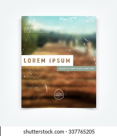 Abstract vector modern flyer / cover design template with old scratched vintage look. Old used weathered texture over retro blurred photographic bokeh background