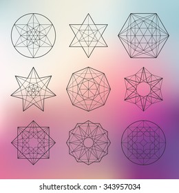 Abstract vector sacred geometrical figures on blurred background