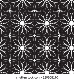 Abstract vector seamless black and white pattern with bloom-like figures.