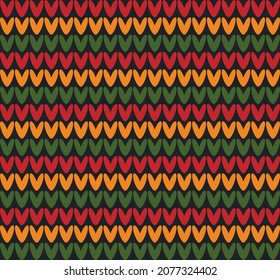 Abstract vector seamless knitting pattern in Pan African flag colors - red, yellow, green on black background. Backdrop ornament for Kwanzaa, Black History Month, Juneteenth design