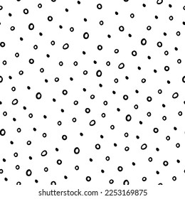 Abstract vector seamless  pattern. Random small black spots on white background. Irregular chaotic hand drawn elements. Simple modern decorative print for textile,  paper, fabric.
