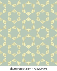 Abstract vector seamless repeat pattern with a pale yellow hexagonal motif resembling flowers on a solid pale green background. For textiles, wallpaper, wraps, packaging, etc.