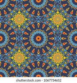 Abstract vector Tribal vintage orange, yellow and blue colorful ethnic seamless pattern.