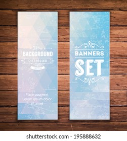 Abstract vertical vector eps10 banners with trendy subtle light blue multicolored polygonal pattern.