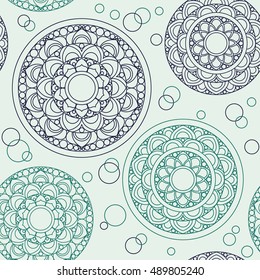 Abstract vintage seamless background with mandala ornaments. Decorative ornate vintage pattern