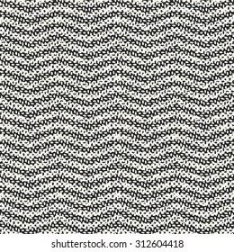 Abstract  wavy stripe in black and white flecks. Seamless pattern.