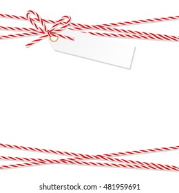 Abstract white background with tag label tied up with red rope bakers twine bow and ribbons