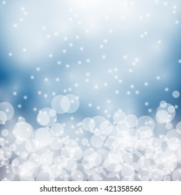 Abstract white bokeh with blue background