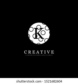 abstract white circle with circles pattern K logo letter isolated on black background design concept. vector illustration.