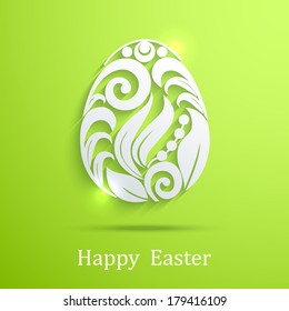 Abstract white floral swirls Easter egg on a green background. Eps10