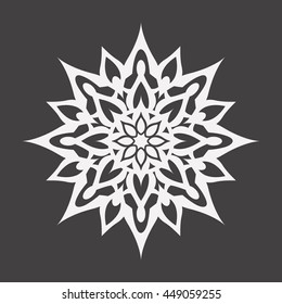 Abstract white flower on a black background..Ornament pattern.Decorative element.