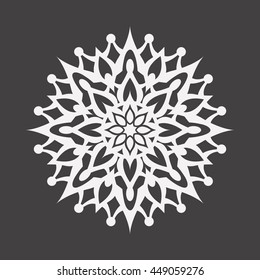 Abstract white flower on a black background..Ornament pattern.Decorative element.