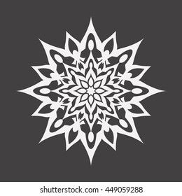 Abstract white flower on a black background..Ornament pattern.Decorative element.