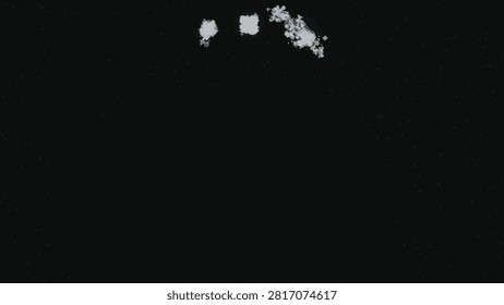 Abstract white paint splashes and distressed speckles on a deep black grunge background with spacious copy space