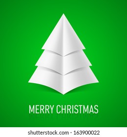 Abstract white paper Christmas tree on green background.