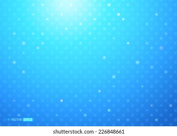 Abstract winter background. Light snowflakes on blue background. There is place for your text.