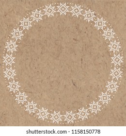 Abstract winter decor on kraft paper.  Vector round frame with place for text.  Greeting card, invitation or isolated elements for design.