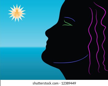 Abstract woman face silhouette looking at the sun by the sea