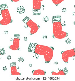 abstract wrapping paper, seamless pattern - christmas socks and white snowflakes on a white background
