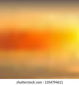 Abstract yellowish orange blurred background, sunset sky. Excellent as a background for the production of any printed product, advertising, or other design.
