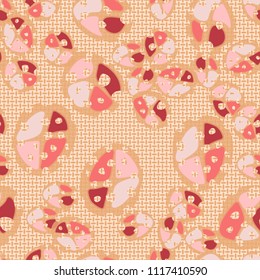 Abstraction. Seamless color pattern made up of multi-colored rounded elements with holes. The picture is superimposed on a background consisting of small mutually perpendicular ovals.