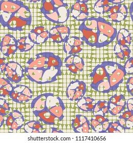 Abstraction. Seamless color pattern made up of multi-colored rounded elements with holes. Under the picture there is a background consisting of broken ovals organized into squares.