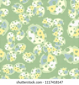 Abstraction. Seamless color pattern made up of multi-colored rounded elements with holes. The picture is superimposed on a background consisting of small mutually perpendicular ovals.