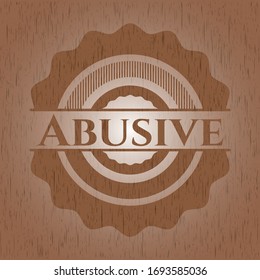 Abusive badge with wooden background