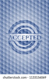 Accepted blue emblem or badge with abstract geometric pattern background.