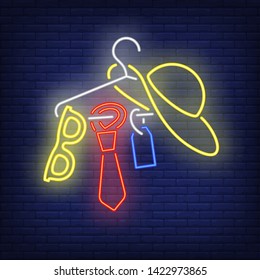 Accessories on hanger neon sign. Shopping, fashion, garment. New collection concept. Vector illustration in neon style for advertising, online shopping, fashion show