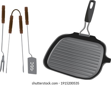 accessories with tongs and fork and cast iron plate