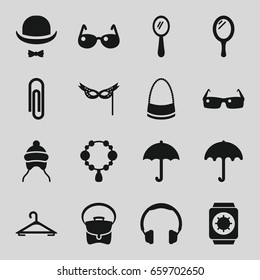 Accessory icons set. set of 16 accessory filled icons such as umbrella, baby cap, mirror, hanger, necklace, bag, hat and moustache, mask, sunglasses, wrist watch with sun