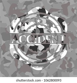 Accident written on a grey camouflage texture