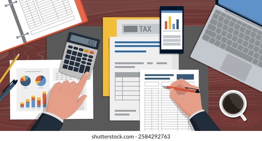 Accountant sitting at the office desk and checking financial reports, desktop top view