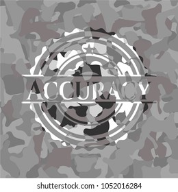 Accuracy on grey camouflaAccuracy written on a grey camouflage textureged texture