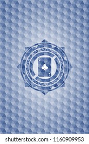ace of clover icon inside blue emblem or badge with abstract geometric polygonal pattern background.
