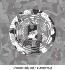 ace of clover icon inside grey camo emblem