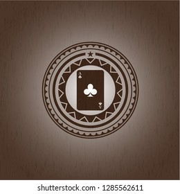 ace of clover icon inside wooden emblem