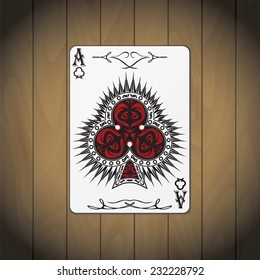 Ace of clubs poker card on wood background