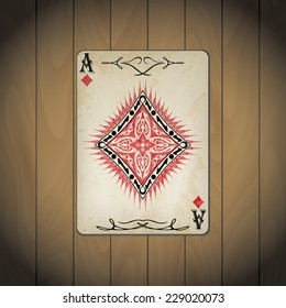 Ace of diamonds poker card old look on wood background