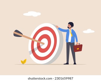 Achieve goal concept. Aspiration and motivation. Business objective, purpose or target, goal and resolution to aim for success. confident businessman stand with arrow hit bullseye on archery target. - Shutterstock ID 2301659987