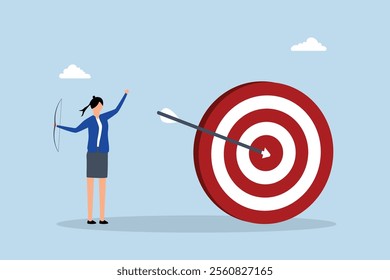 Achieve target, Joyful businesswoman releases arrow in archery aimed at large target. 