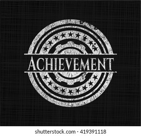 Achievement chalk emblem written on a blackboard