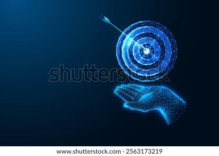 Achievement concept with glowing digital hand holding target hit by arrow on dark blue background. Success, goal setting, precision, focus, business strategy. Futuristic low-poly vector illustration.
