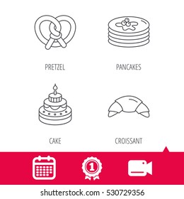 Achievement and video cam signs. Croissant, pretzel and pancakes icons. Sweet cake linear sign. Calendar icon. Vector